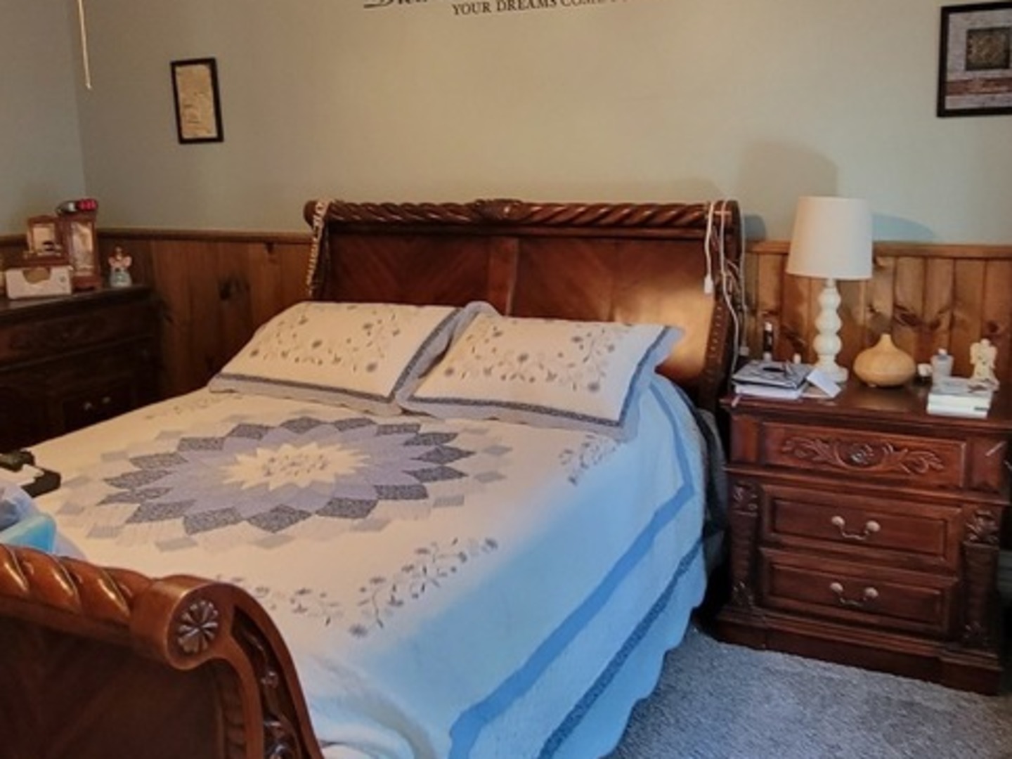 103 North Maple Street Momence, IL 60954 - Photo 21 of 43 a bed sitting in a bedroom next to a lamp