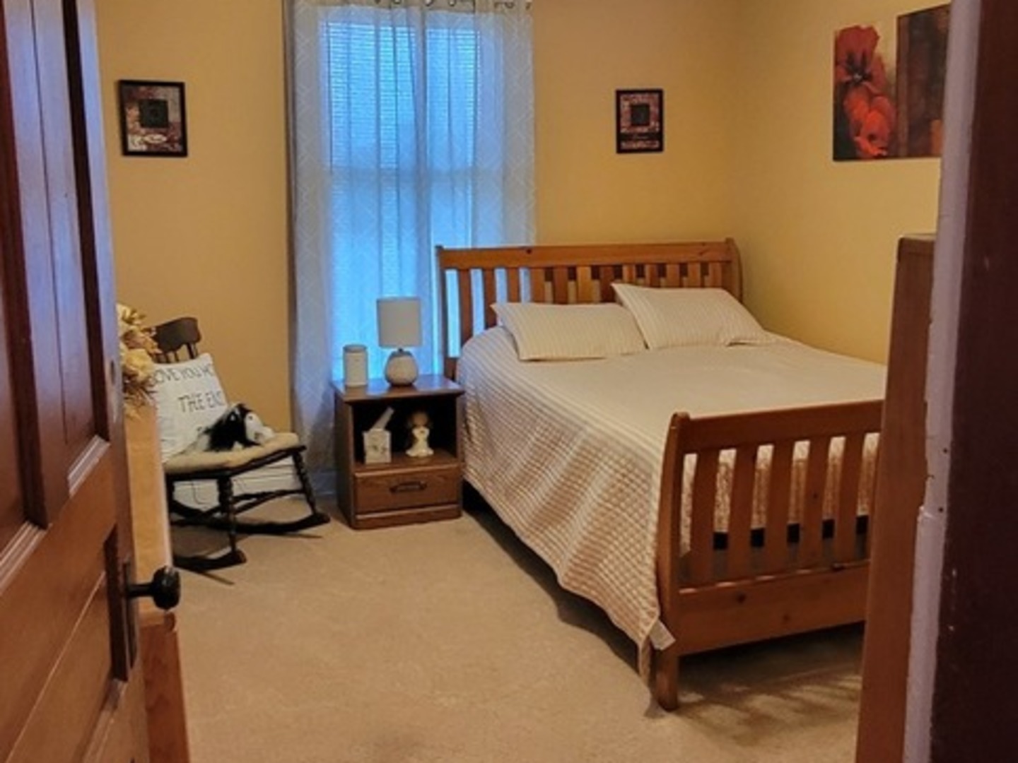 103 North Maple Street Momence, IL 60954 - Photo 24 of 43 a bedroom with a bed and wooden floor