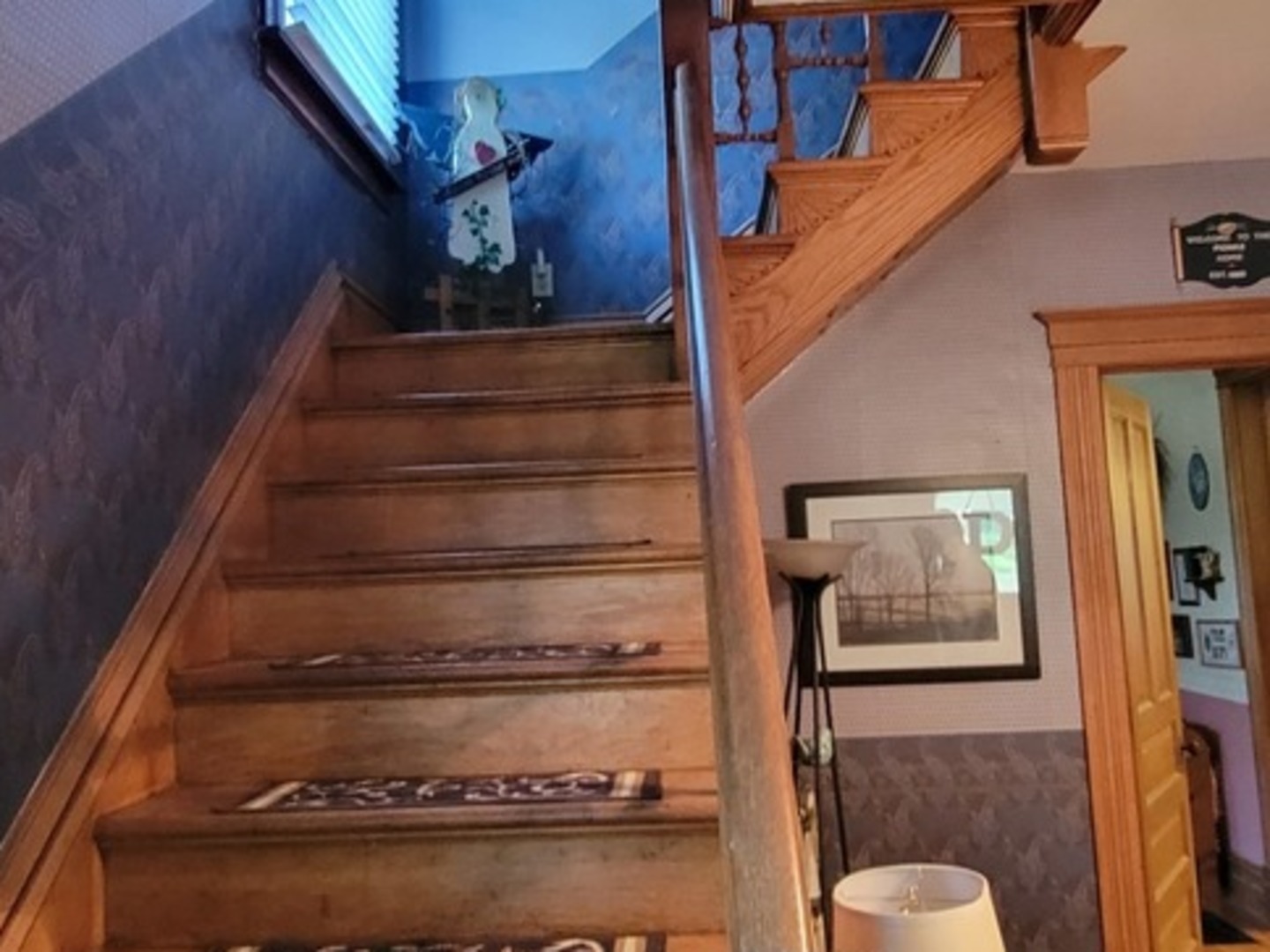 103 North Maple Street Momence, IL 60954 - Photo 27 of 43 a view of staircase with white walls and a window