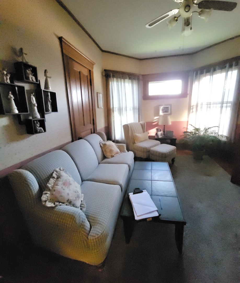 103 North Maple Street Momence, IL 60954 - Photo 34 of 43 a living room with furniture and a large window