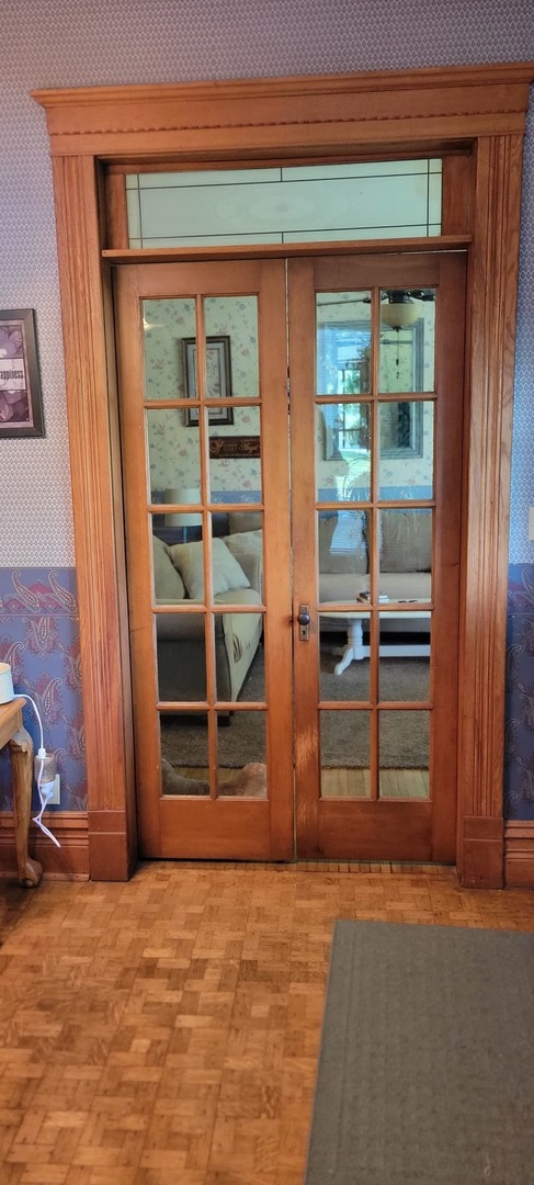 103 North Maple Street Momence, IL 60954 - Photo 5 of 43 a view of an empty room with a fireplace and a window