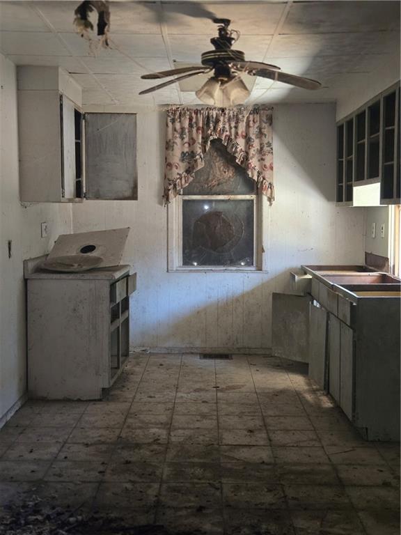 1922 Rhine Street Pittsburgh, PA 15212 - Photo 29 of 32 a kitchen with granite countertop a stove top oven a sink a counter space and cabinets