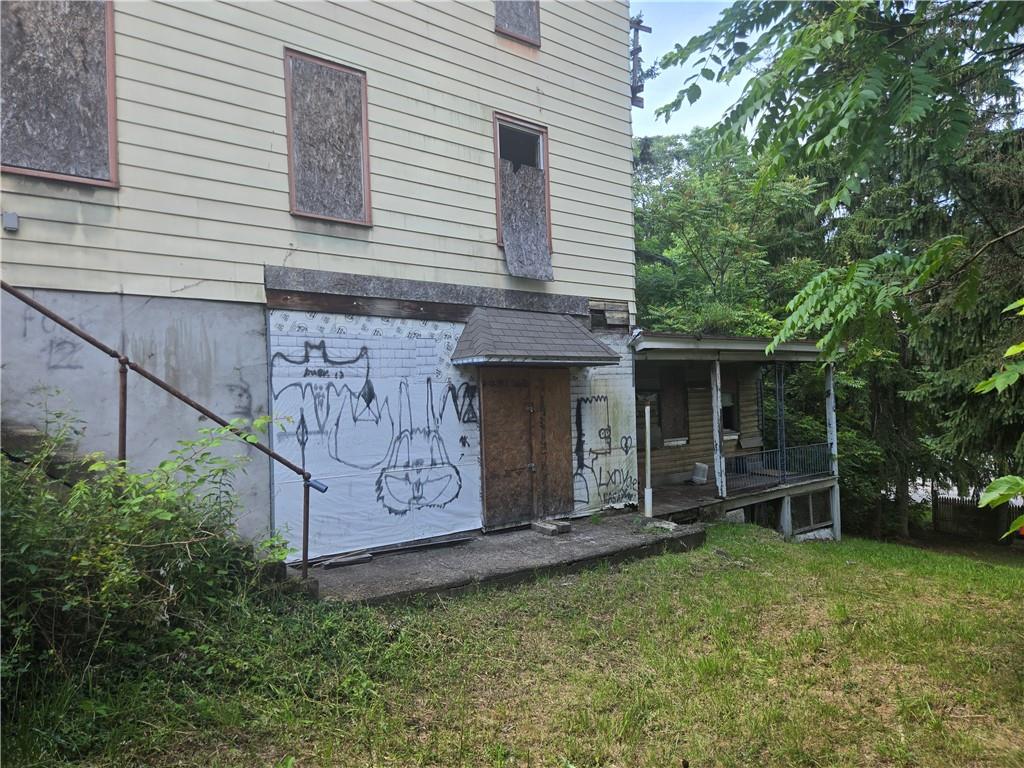1922 Rhine Street Pittsburgh, PA 15212 - Photo 7 of 32 a view of a backyard with potted plants and a bench