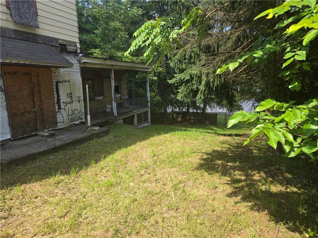1922 Rhine Street Pittsburgh, PA 15212 - Photo 8 of 32 a view of a lounge chair in the backyard of house