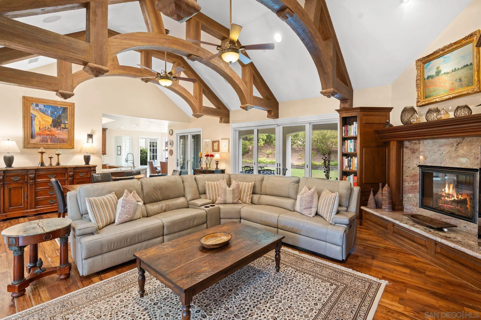 546 Morro Hills Road Fallbrook, CA 92028 - Photo 11 of 52 a living room with furniture a flat screen tv and a fireplace