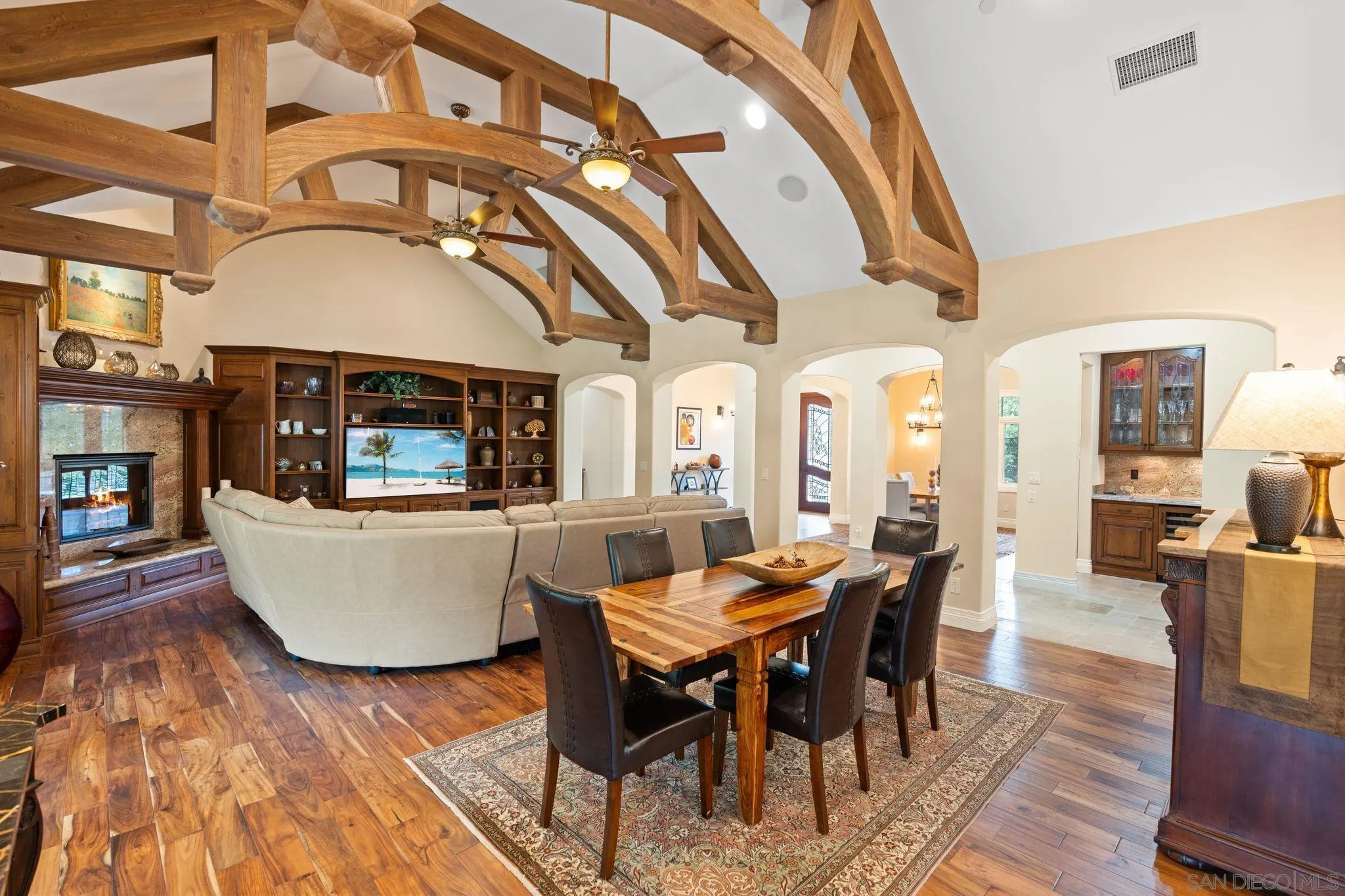 546 Morro Hills Road Fallbrook, CA 92028 - Photo 12 of 52 a living room with a table a dining table a rug and a stove