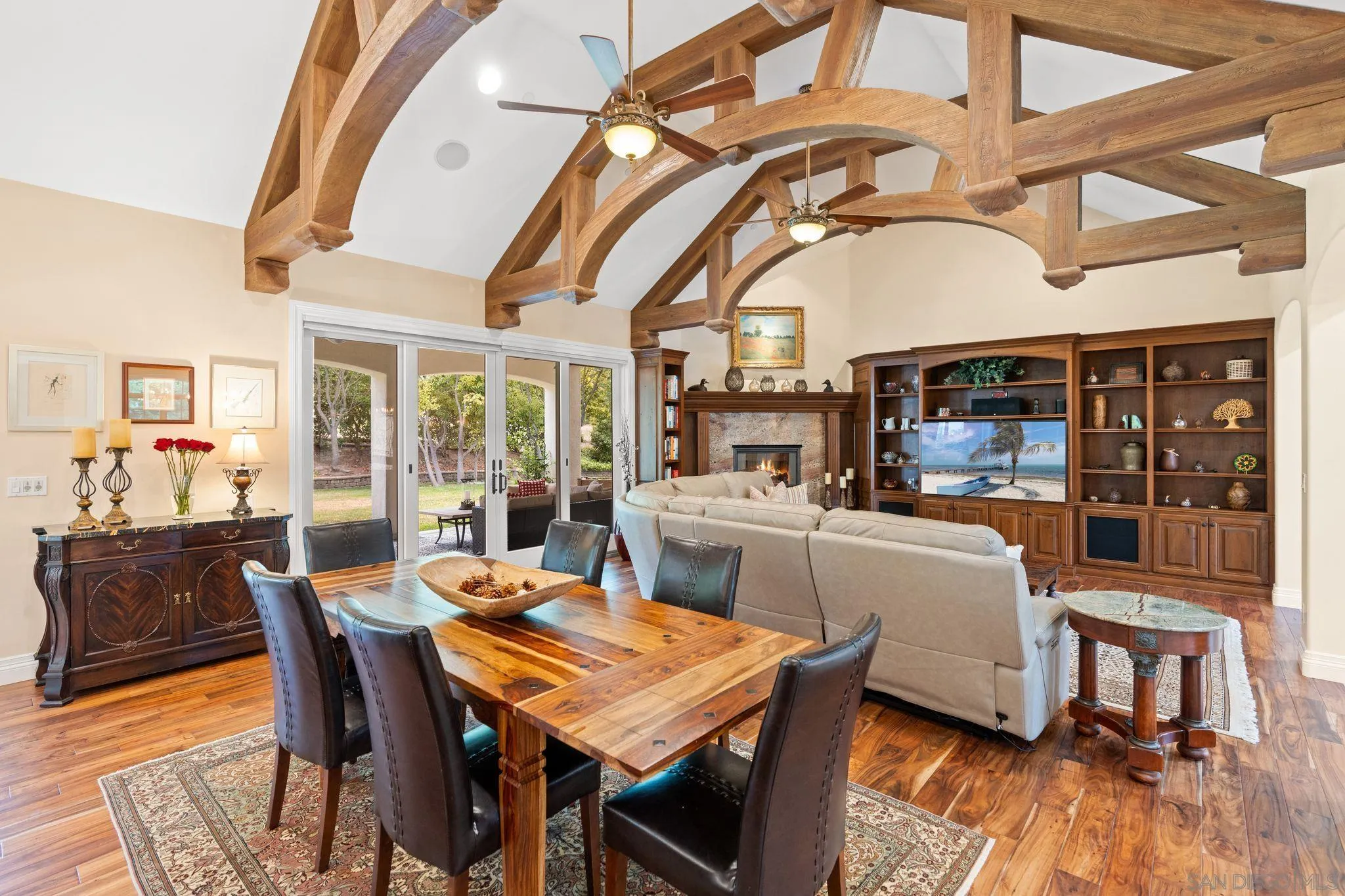 546 Morro Hills Road Fallbrook, CA 92028 - Photo 13 of 52 a dining room with stainless steel appliances granite countertop a dining table and chairs with wooden floor
