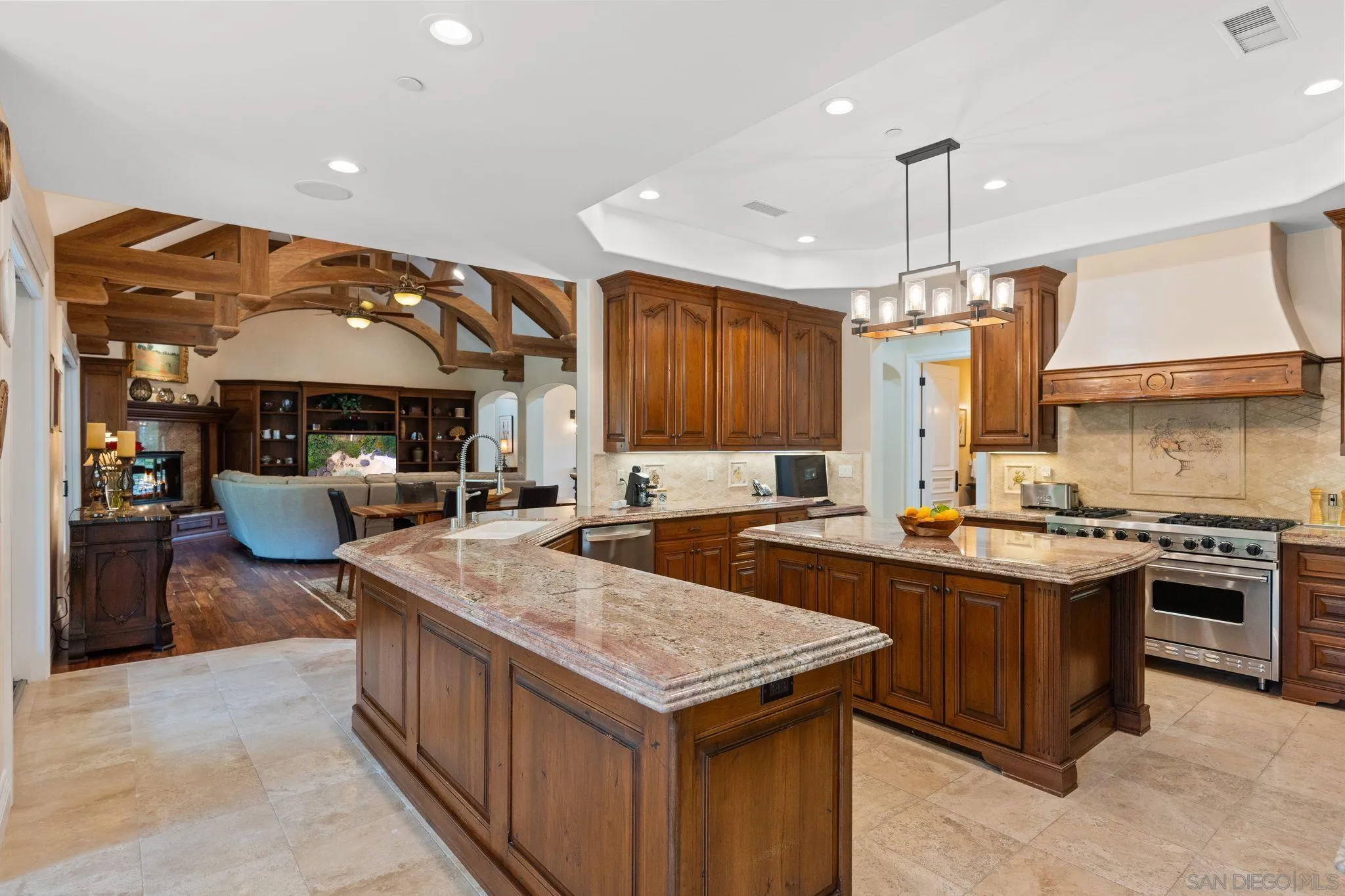 546 Morro Hills Road Fallbrook, CA 92028 - Photo 15 of 52 a kitchen with stainless steel appliances granite countertop a stove and a sink