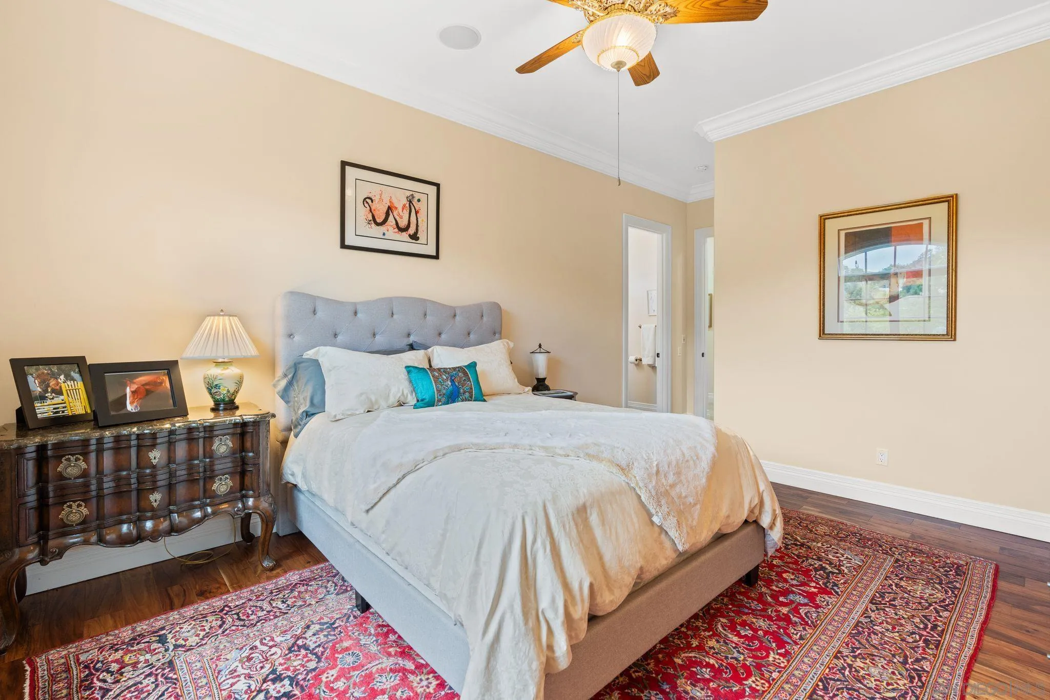 546 Morro Hills Road Fallbrook, CA 92028 - Photo 20 of 52 a bedroom with a bed and a book shelf