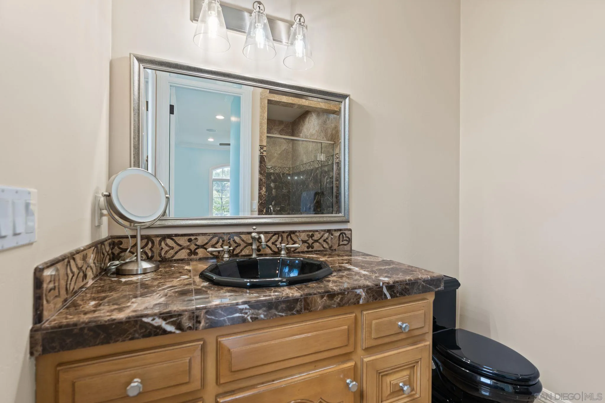 546 Morro Hills Road Fallbrook, CA 92028 - Photo 23 of 52 a bathroom with a granite countertop sink and a mirror