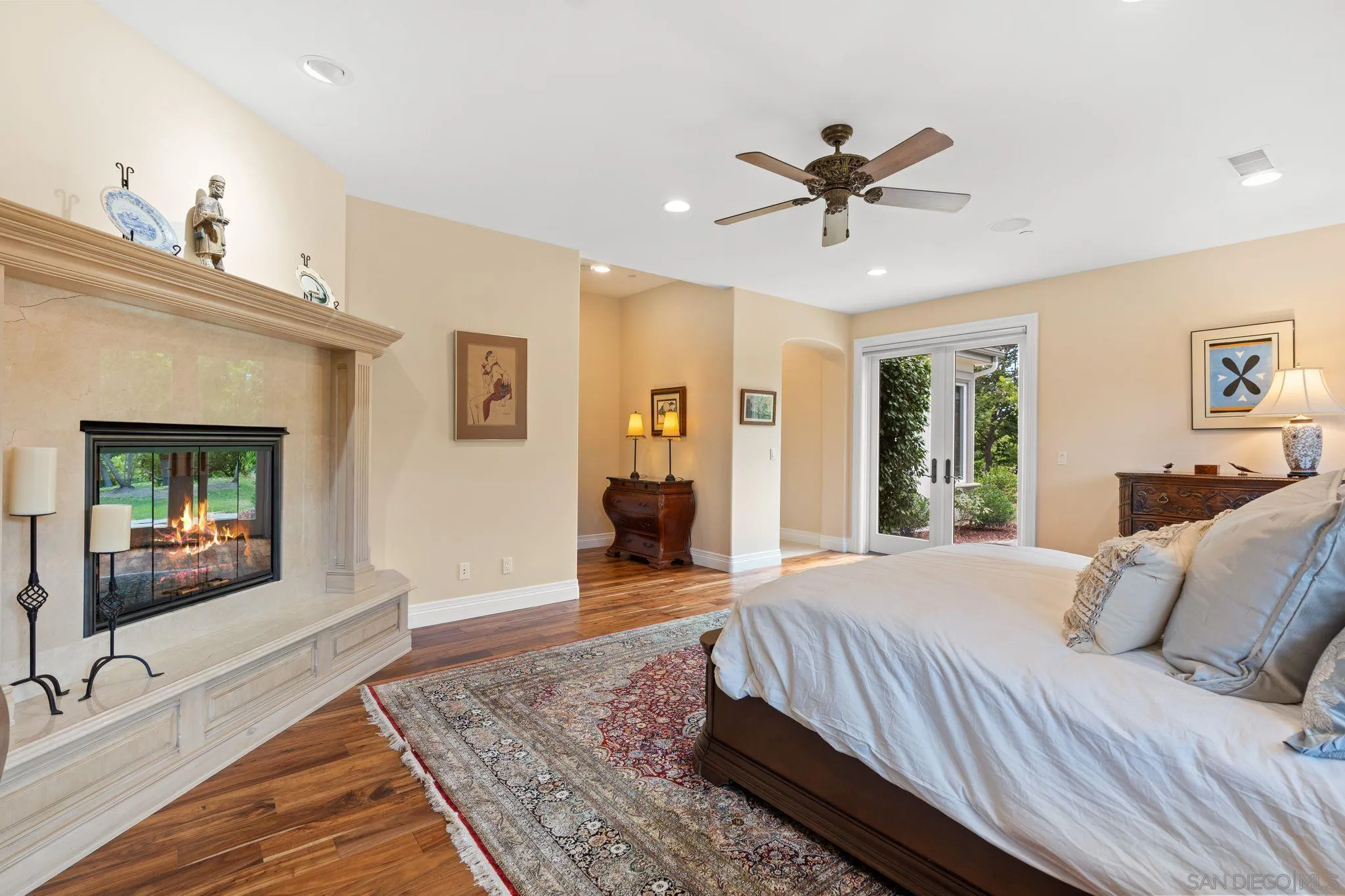 546 Morro Hills Road Fallbrook, CA 92028 - Photo 27 of 52 a bedroom with a bed wooden floor and window