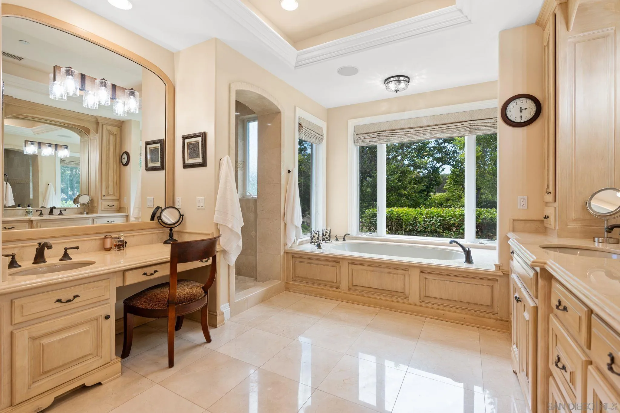 546 Morro Hills Road Fallbrook, CA 92028 - Photo 28 of 52 a spacious bathroom with a sink and a large mirror