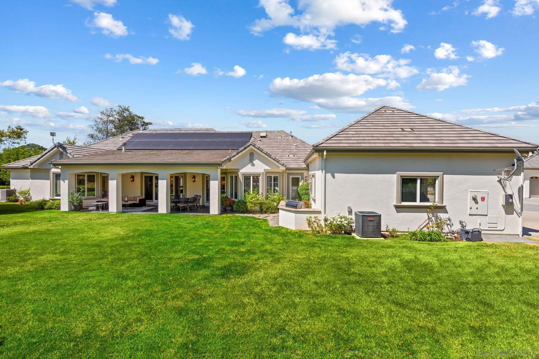 546 Morro Hills Road Fallbrook, CA 92028 - Photo 34 of 52 a front view of a house with a garden and porch