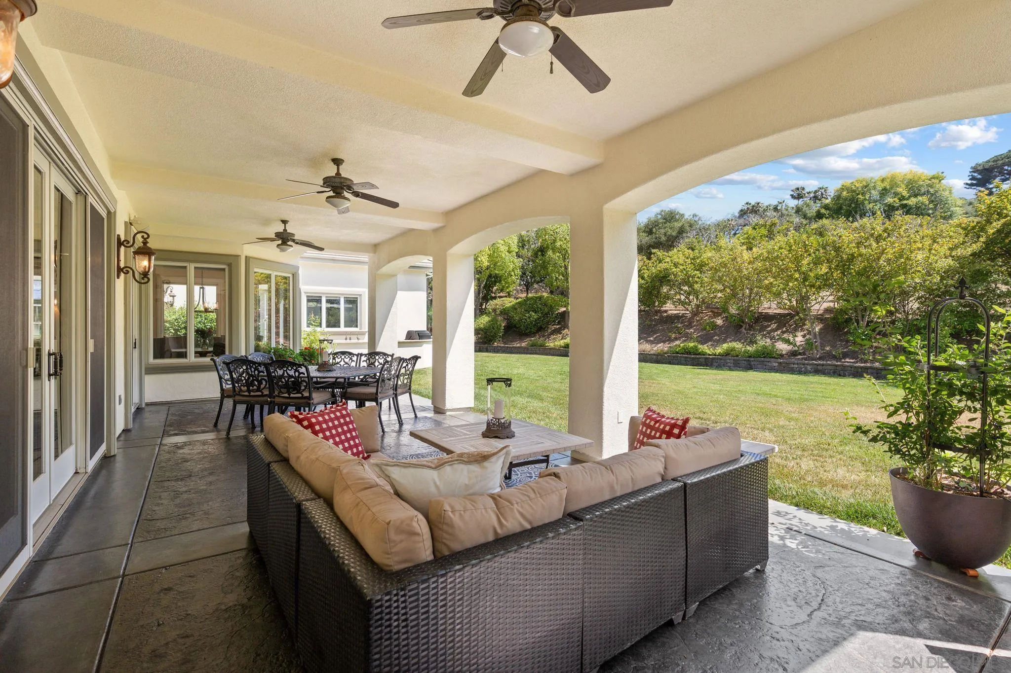 546 Morro Hills Road Fallbrook, CA 92028 - Photo 35 of 52 a living room with patio furniture and a floor to ceiling window