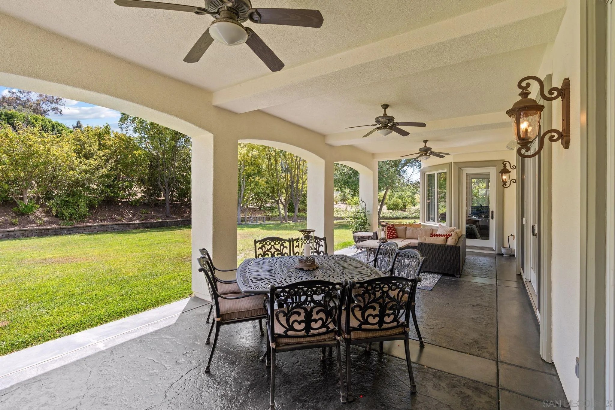 546 Morro Hills Road Fallbrook, CA 92028 - Photo 36 of 52 a dining room with furniture and a floor to ceiling window