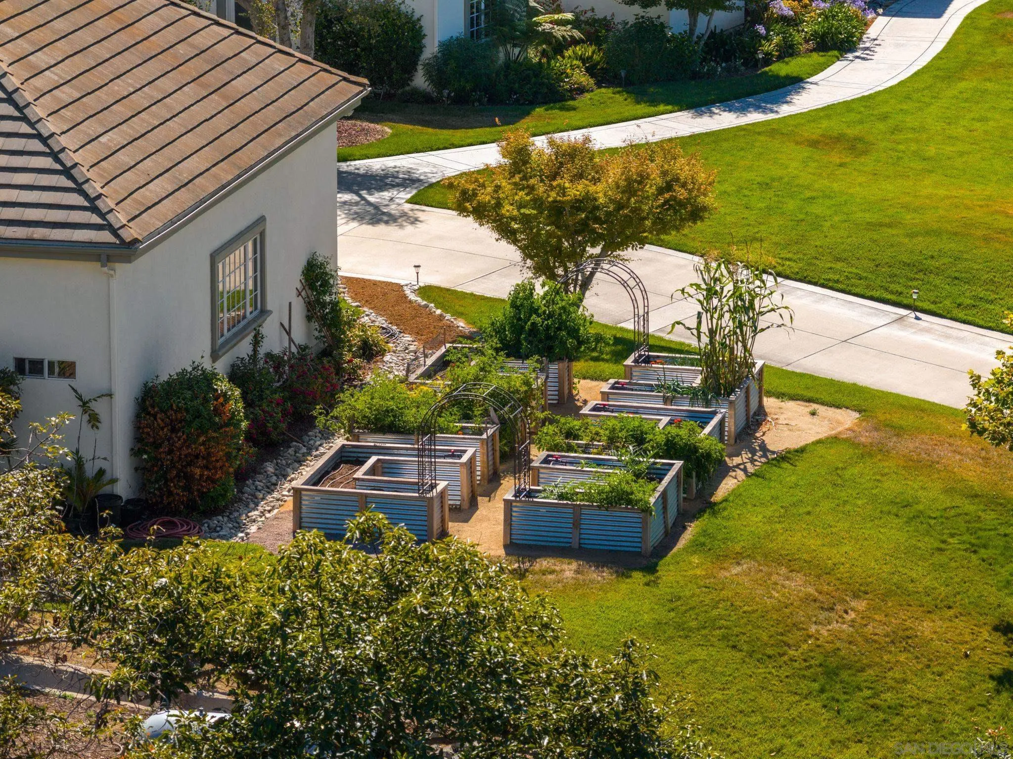 546 Morro Hills Road Fallbrook, CA 92028 - Photo 38 of 52 an aerial view of a house with a garden and lake view
