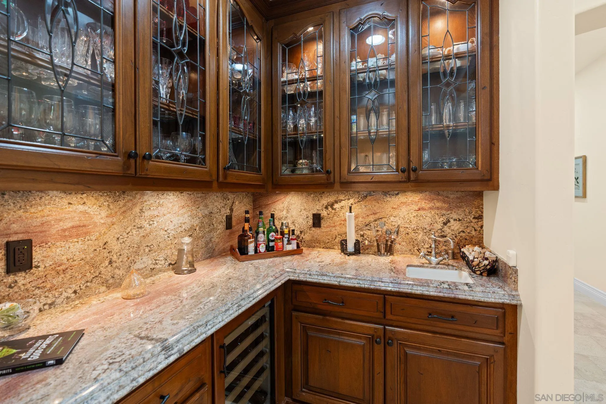 546 Morro Hills Road Fallbrook, CA 92028 - Photo 10 of 52 a kitchen with granite countertop a sink and cabinets