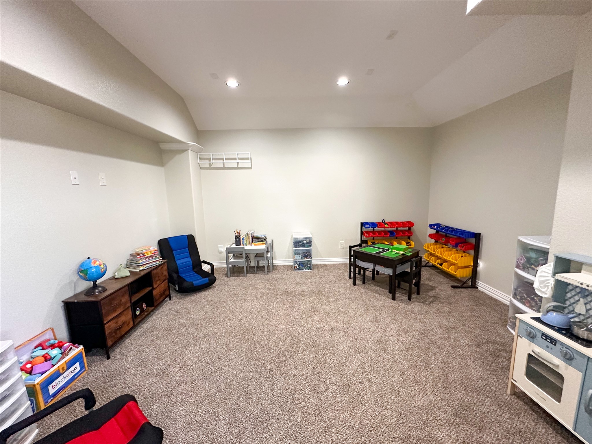 237 Cardinal Drive Paige, TX 78659 - Photo 23 of 37 Game room featuring carpet, lofted ceiling, and recessed lighting