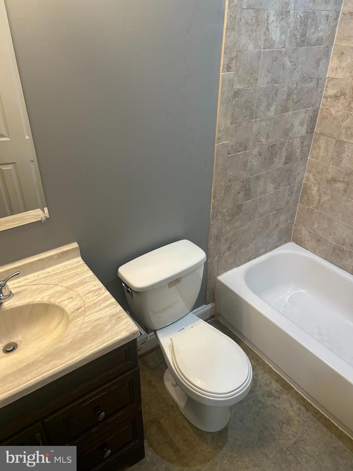 1924 16th Street Southeast Washington, DC 20020 - Photo 11 of 14 a white toilet sitting next to a bathroom sink