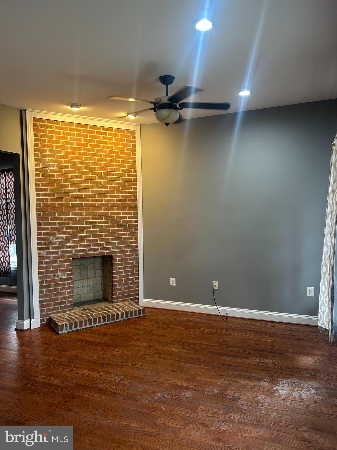 1924 16th Street Southeast Washington, DC 20020 - Photo 2 of 14 a view of an empty room with a window and a fireplace