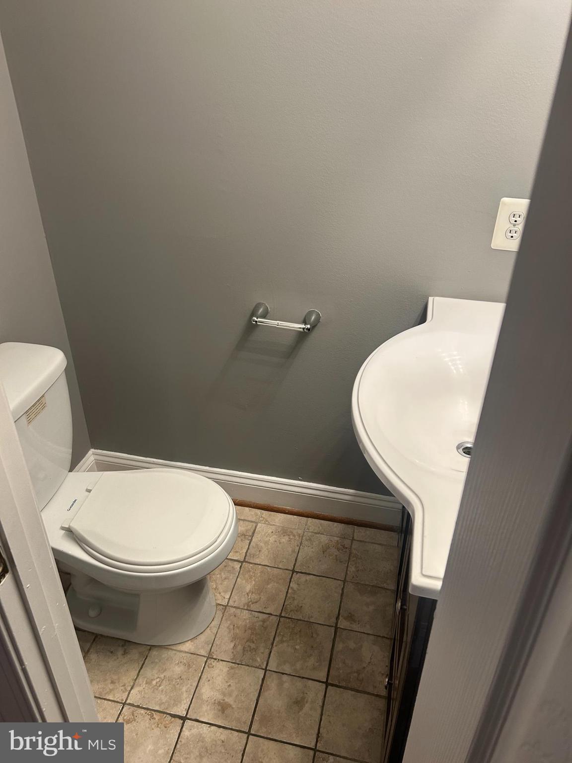 1924 16th Street Southeast Washington, DC 20020 - Photo 7 of 14 a bathroom with a toilet and a mirror