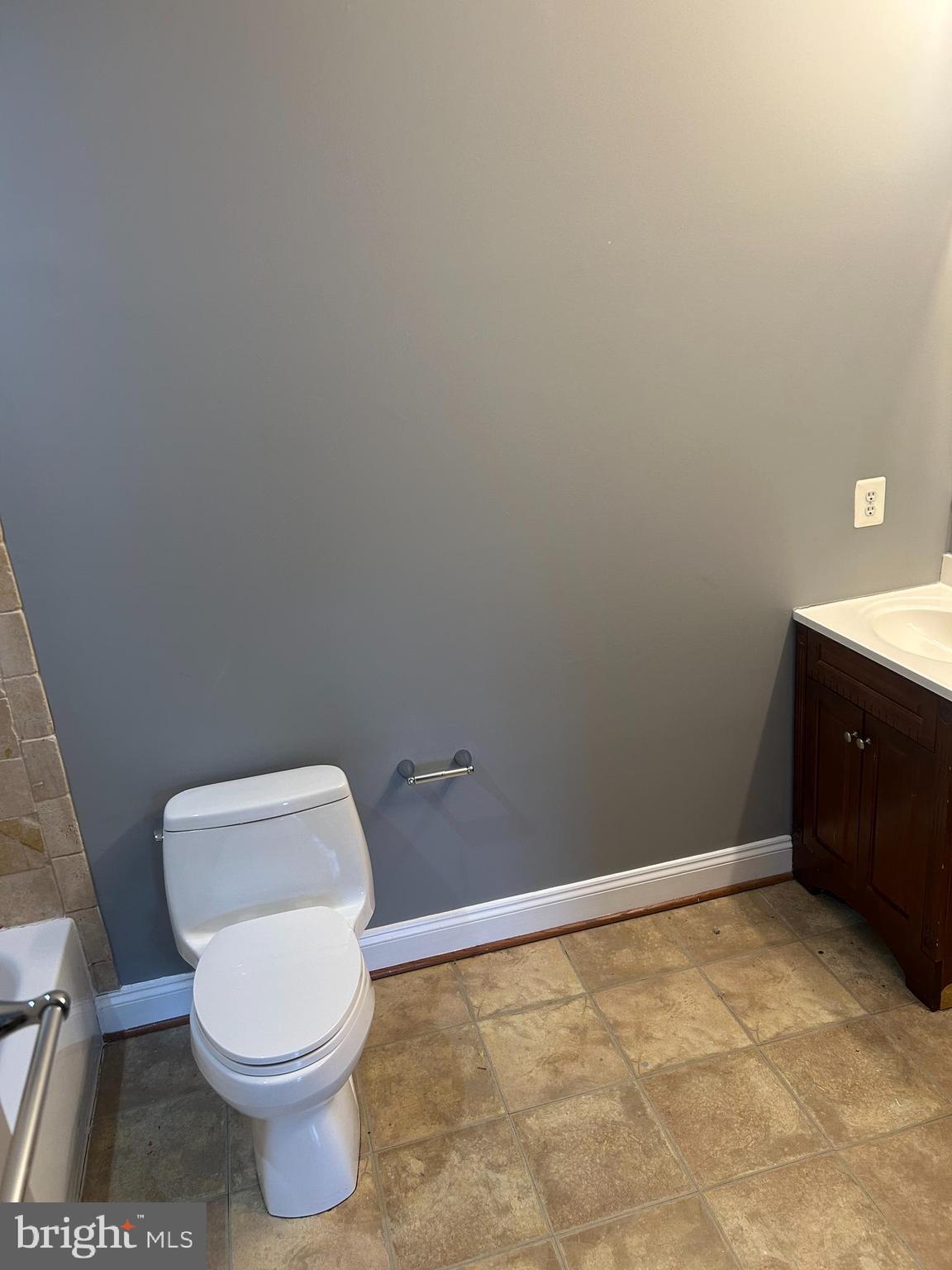 1924 16th Street Southeast Washington, DC 20020 - Photo 10 of 14 a white toilet sitting next to a sink