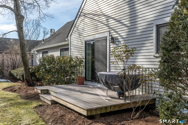 a view of a wooden bench sitting in backyard