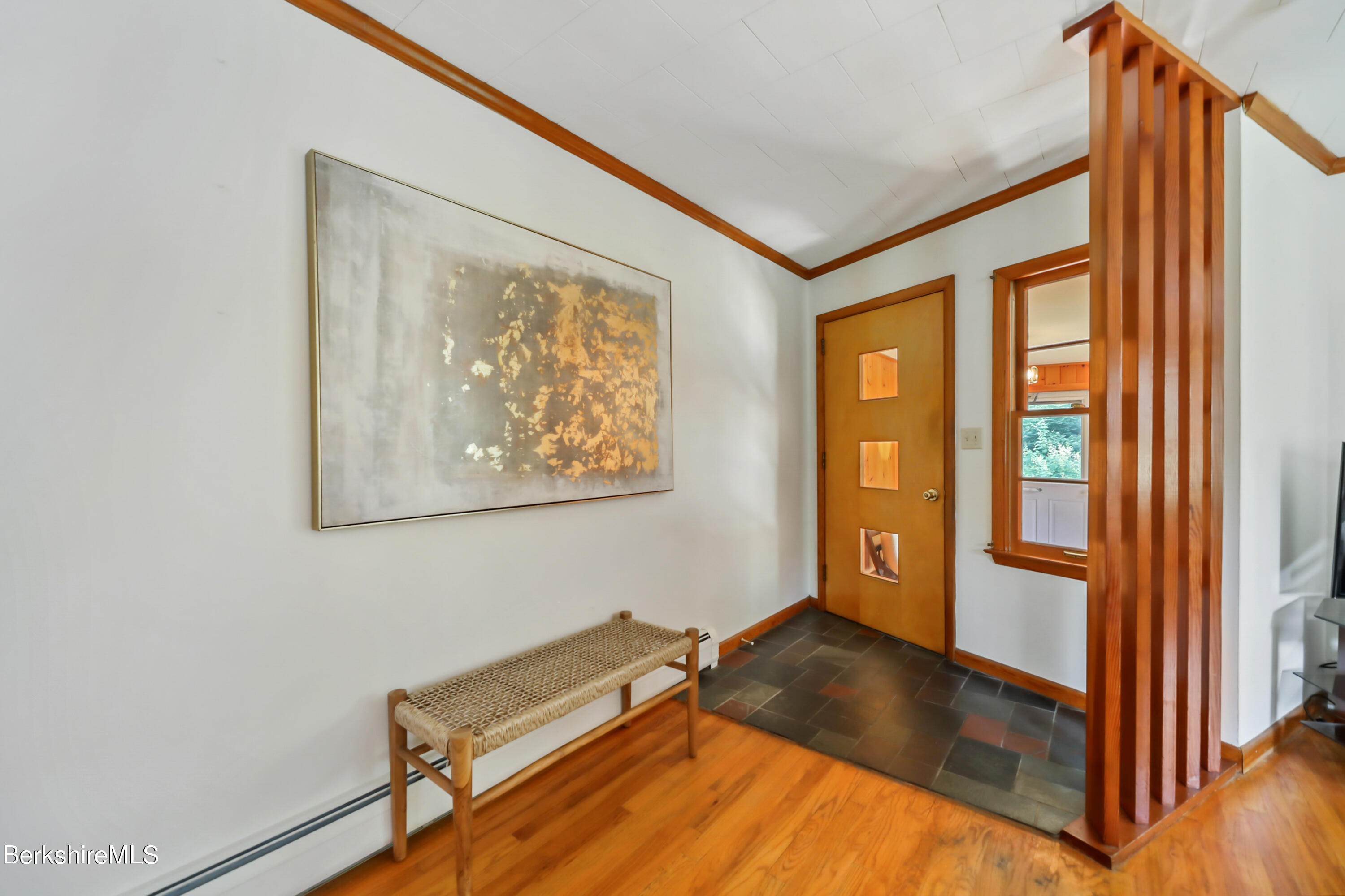 346 Main Road Monterey, MA 01245 - Photo 13 of 28 a view of an empty room with wooden floor and a window