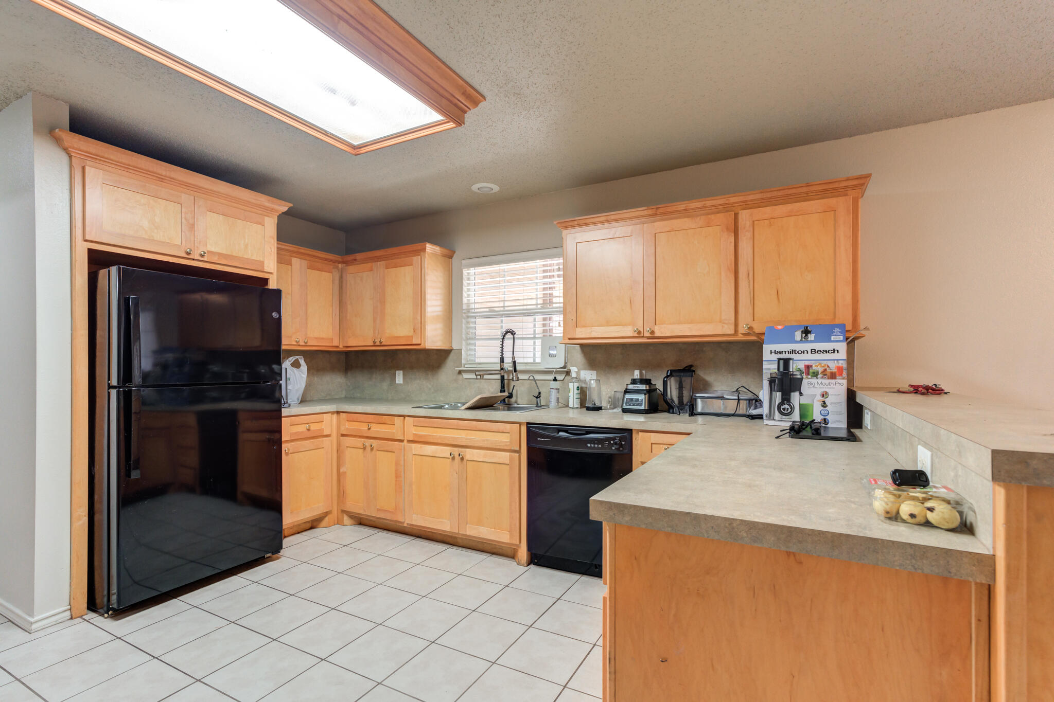 3114 109th Street Lubbock, TX 79423 - Photo 11 of 24 a kitchen with a sink appliances and cabinets