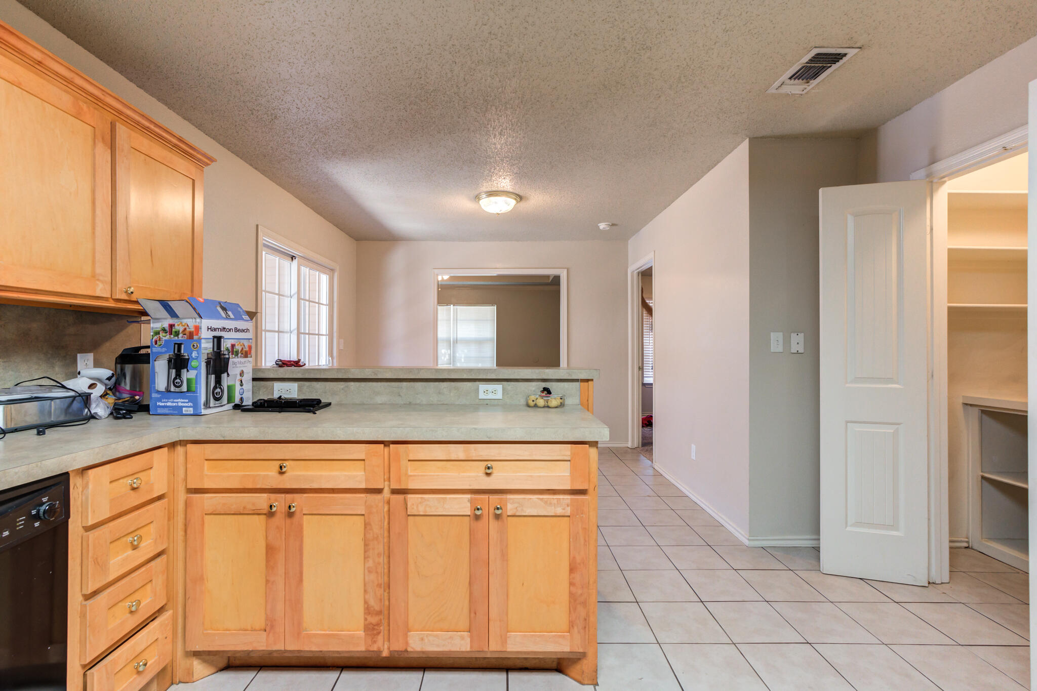 3114 109th Street Lubbock, TX 79423 - Photo 15 of 24 a kitchen with stainless steel appliances granite countertop a sink and cabinets