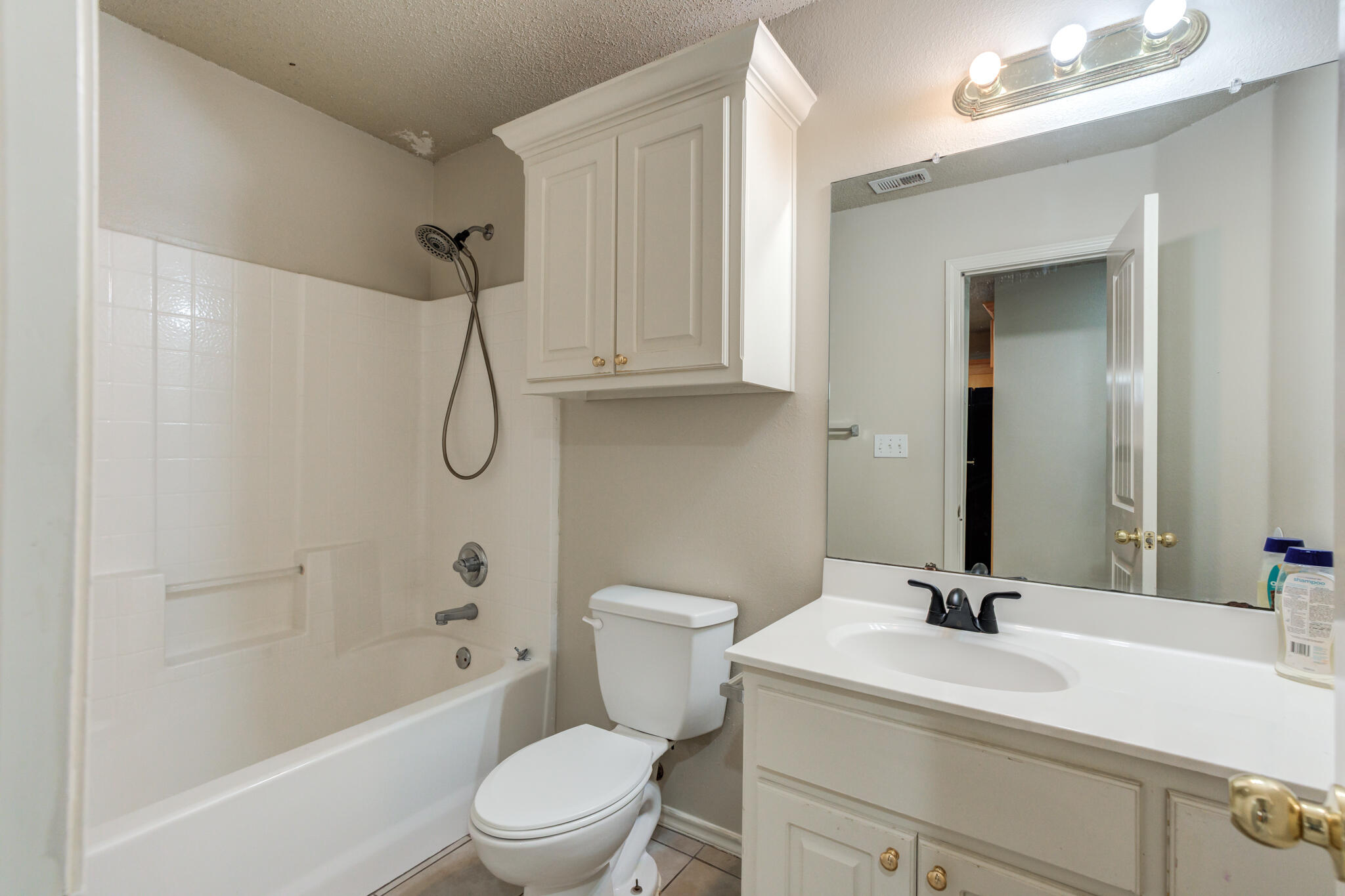 3114 109th Street Lubbock, TX 79423 - Photo 18 of 24 a bathroom with a sink a toilet and shower