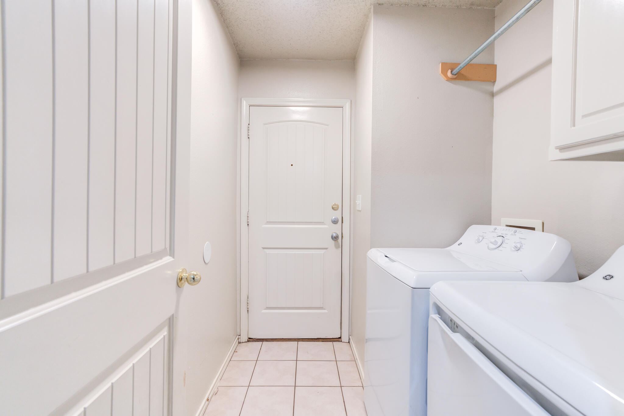 3114 109th Street Lubbock, TX 79423 - Photo 20 of 24 a utility room with dryer and washer
