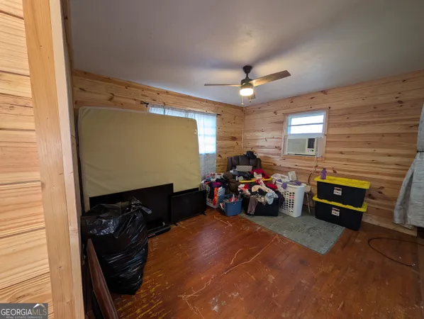a view of a garage with a car parked next to a window