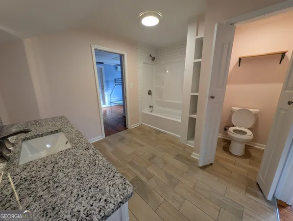a bathroom with a sink and a toilet
