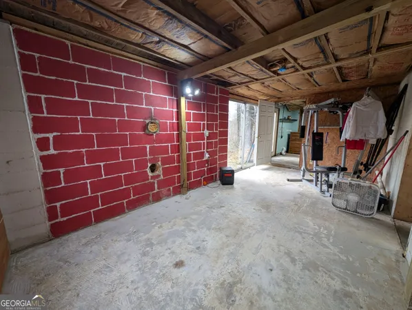 a view of a room with wooden walls