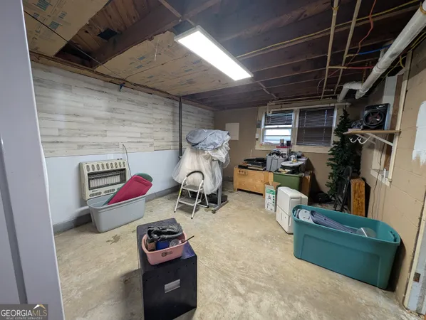 a room with furniture and a flat screen tv