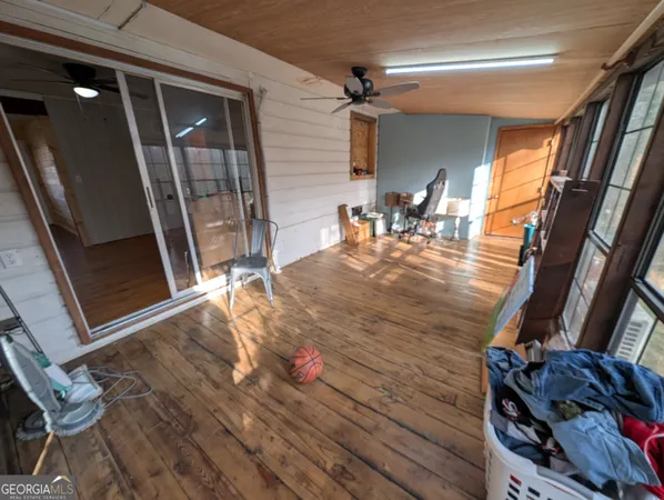 a view of a living room and wooden floor