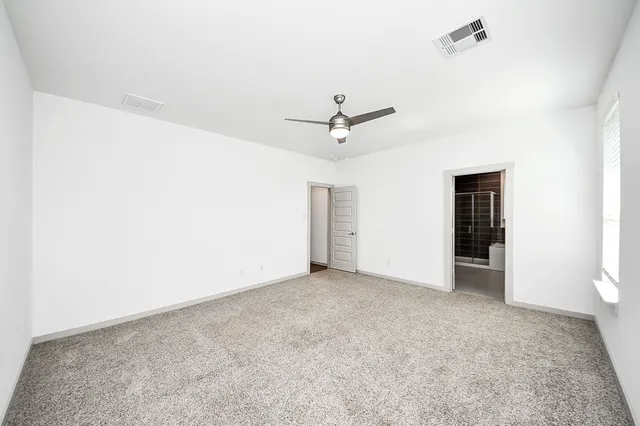 a bathroom with a double vanity sink mirror and shower