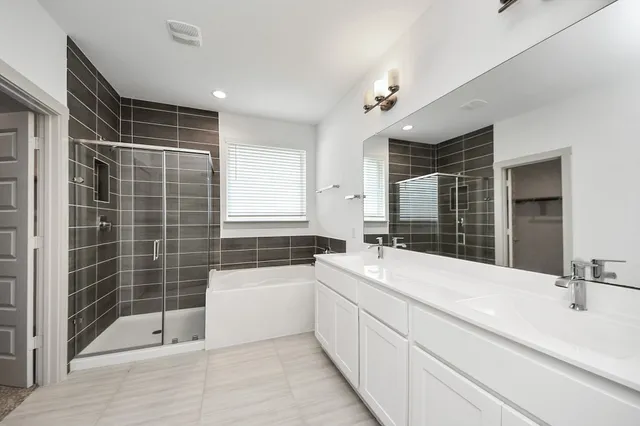 a bathroom with a double vanity sink a vanity and a mirror