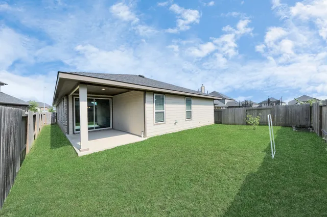 a backyard of a house with lots of green space