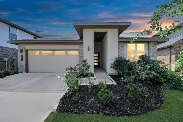 a view of a garden with lawn chairs