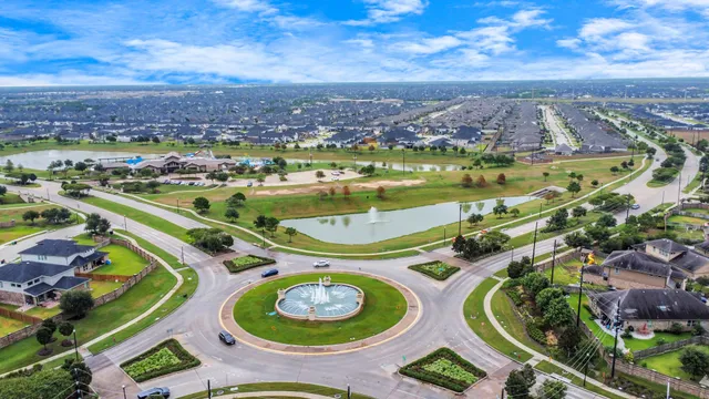 an aerial view of a house with a swimming pool yard and outdoor seating