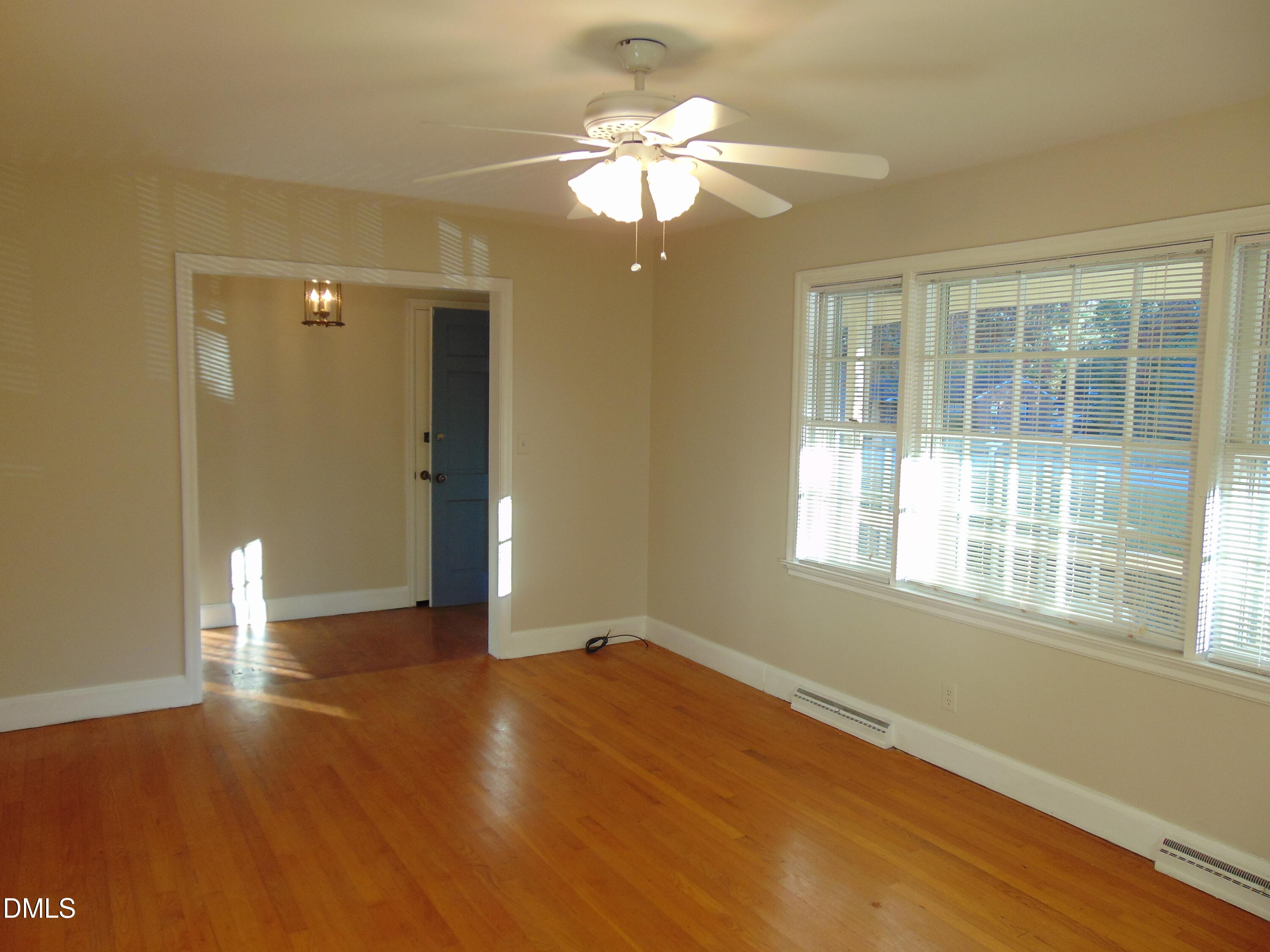 3108 Ridgecrest Drive Rocky Mount, NC 27803 - Photo 11 of 55 a view of an empty room with wooden floor and a window