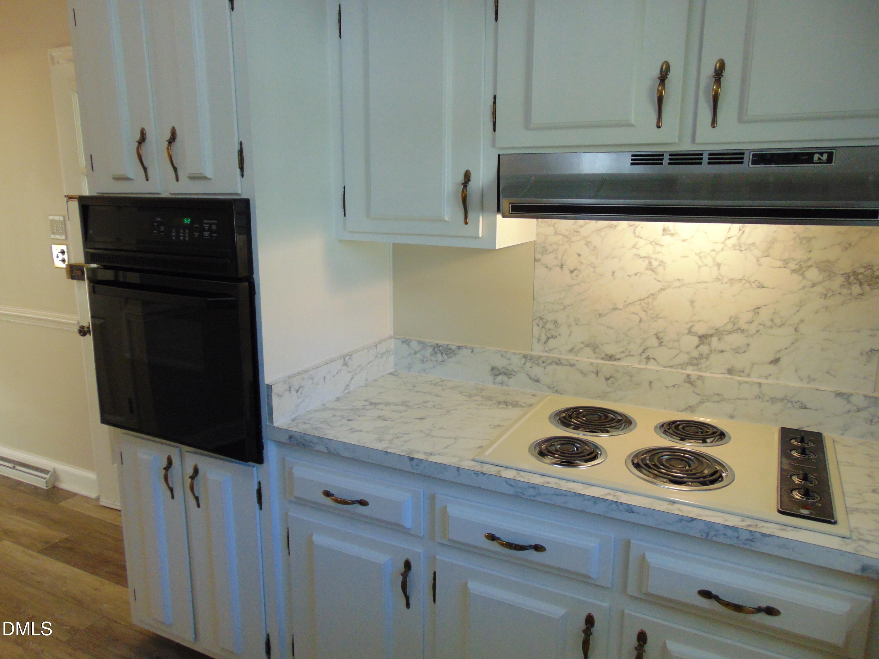 3108 Ridgecrest Drive Rocky Mount, NC 27803 - Photo 17 of 55 a kitchen with a stove and a cabinets
