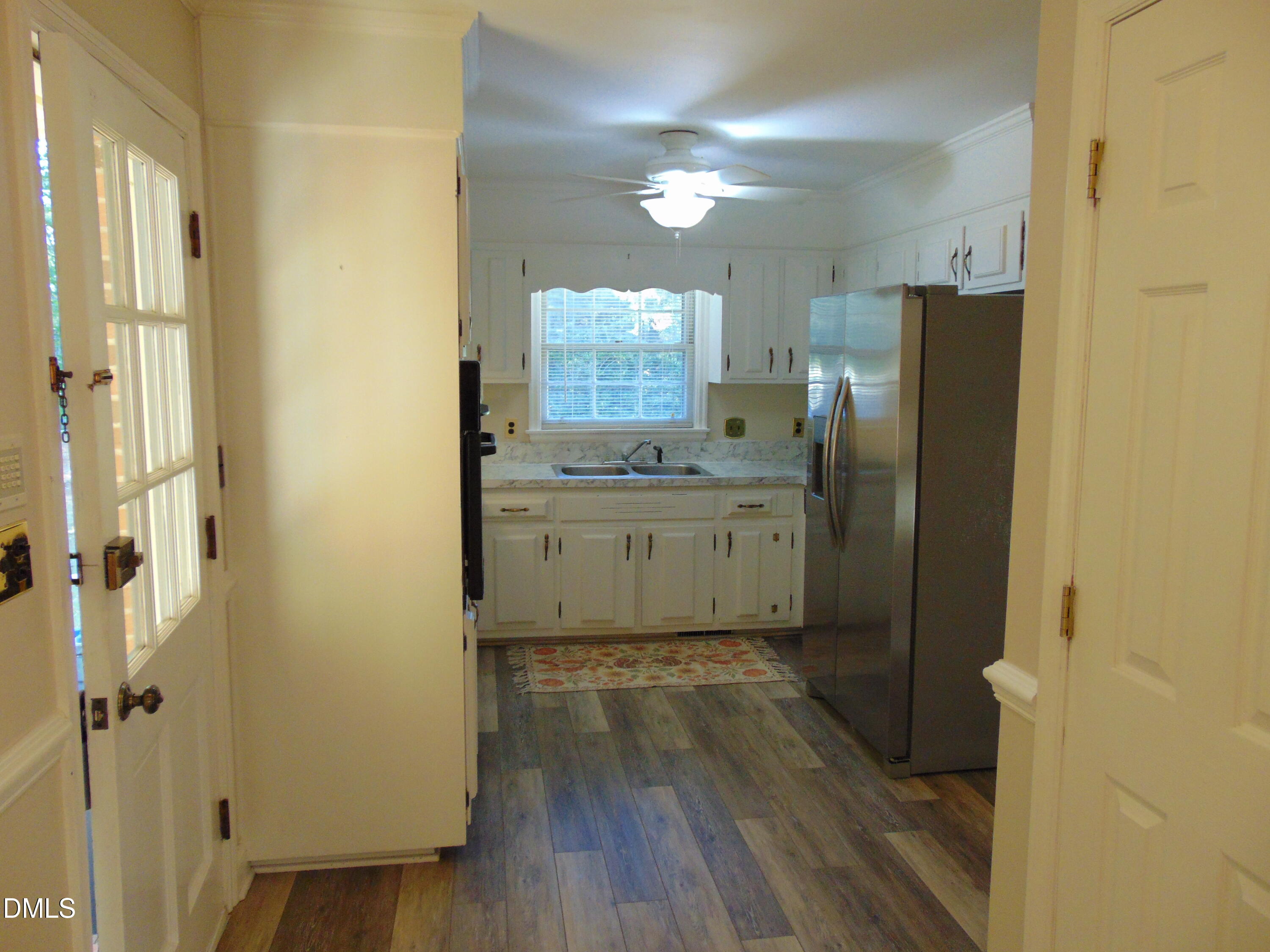 3108 Ridgecrest Drive Rocky Mount, NC 27803 - Photo 19 of 55 a bathroom with a sink a mirror a vanity and a shower