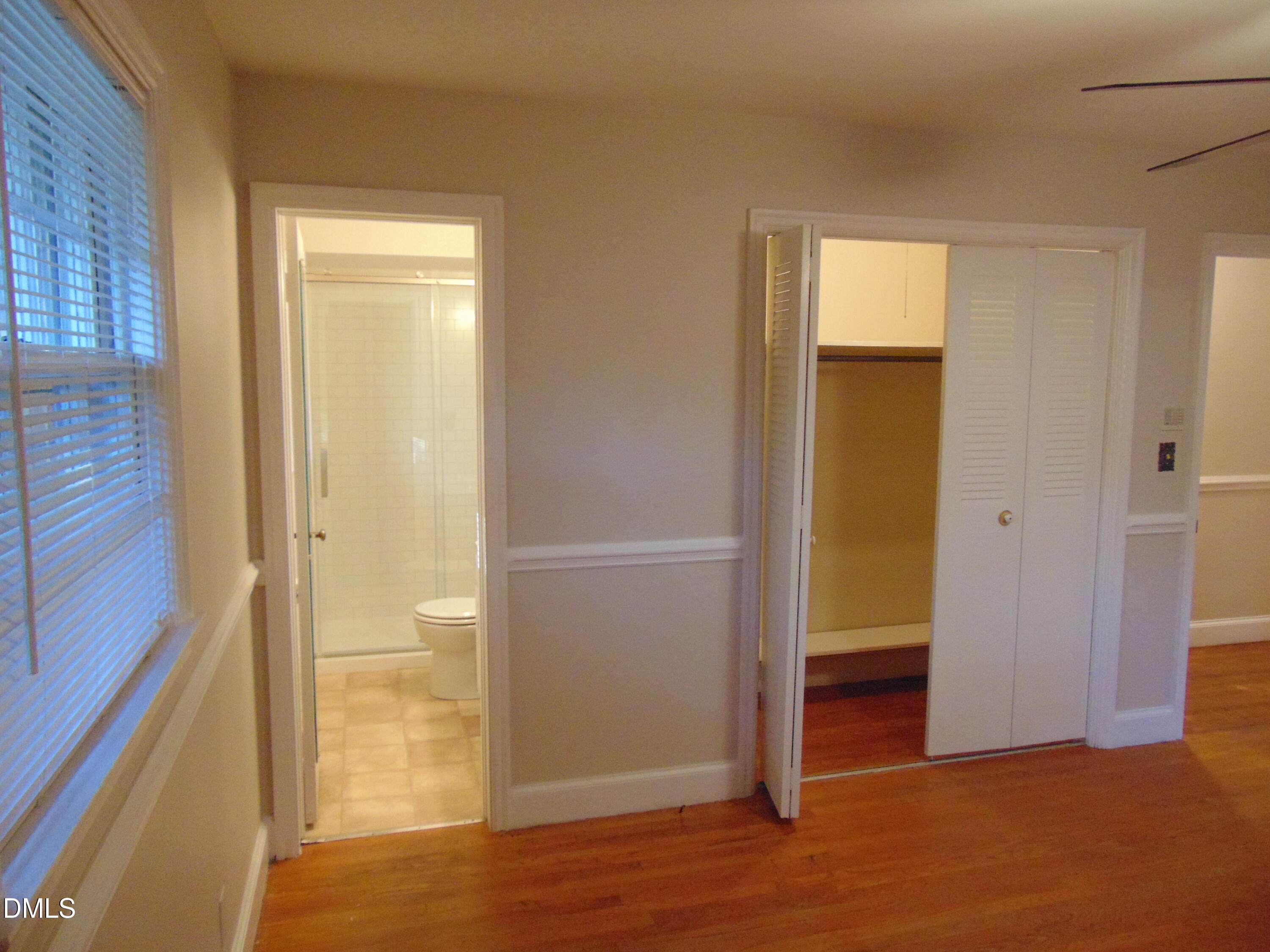 3108 Ridgecrest Drive Rocky Mount, NC 27803 - Photo 30 of 55 an empty room with wooden floor closet and windows