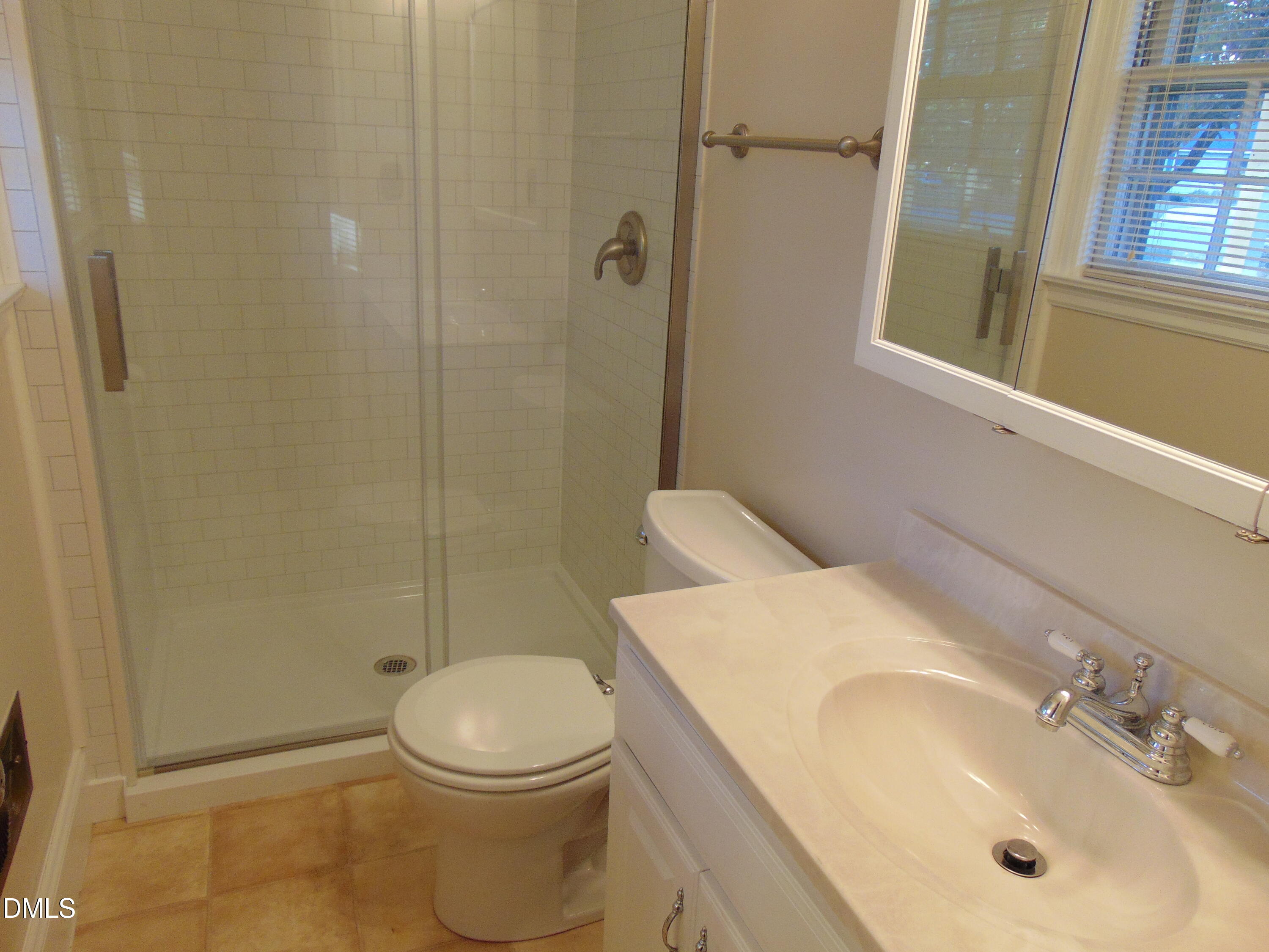 3108 Ridgecrest Drive Rocky Mount, NC 27803 - Photo 36 of 55 a bathroom with a sink a toilet and shower