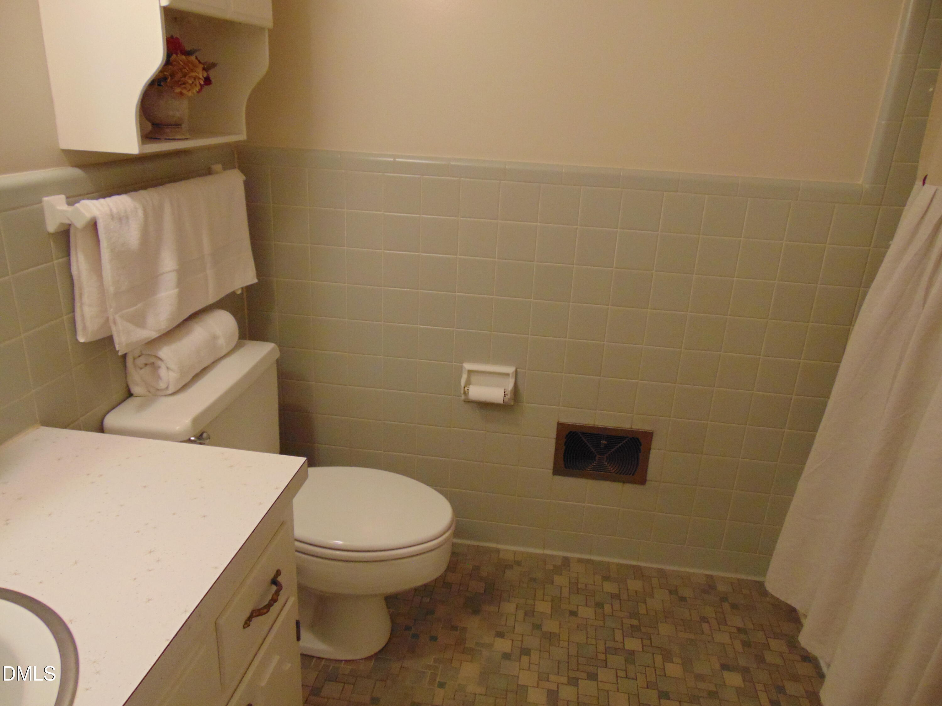 3108 Ridgecrest Drive Rocky Mount, NC 27803 - Photo 41 of 55 a bathroom with a toilet and a shower