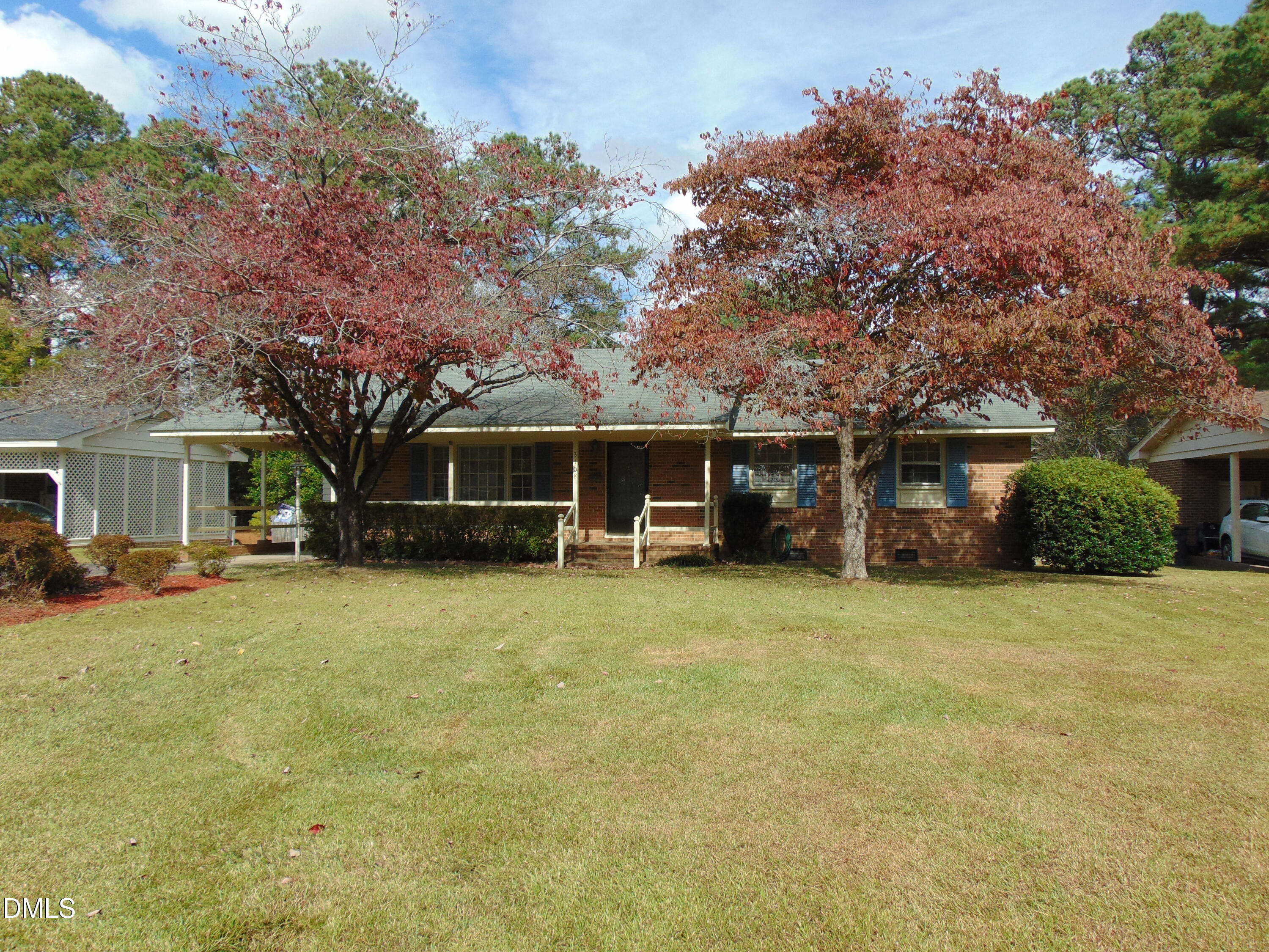 3108 Ridgecrest Drive Rocky Mount, NC 27803 - Photo 54 of 55 a front view of a house with a garden and trees