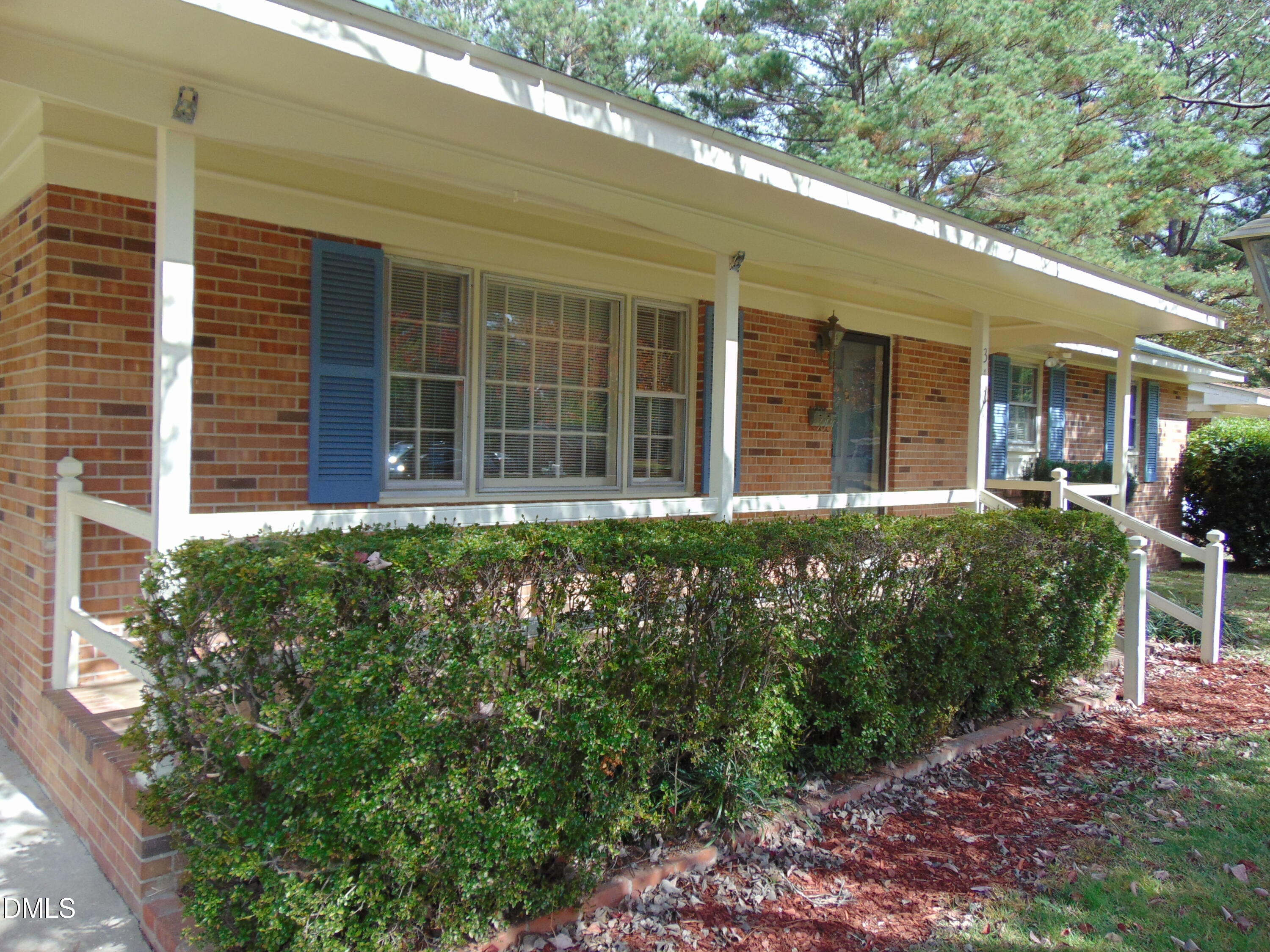3108 Ridgecrest Drive Rocky Mount, NC 27803 - Photo 7 of 55 a front view of a house with a garden